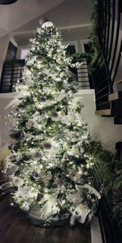 Faux Christmas Tree with white decorations and light