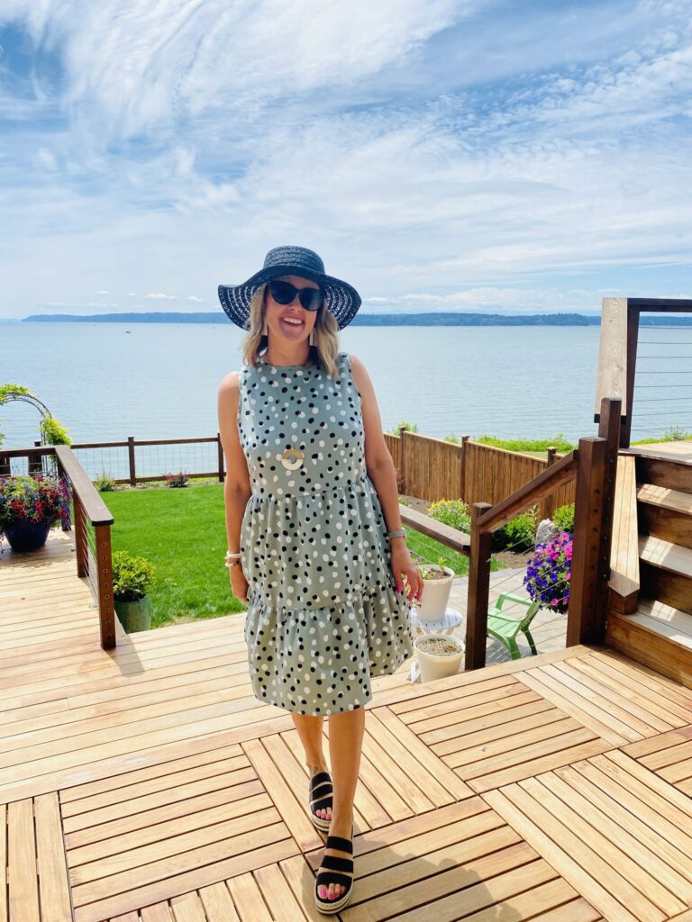 woman wearing polka dot dress for Amazon Summer Style Roundup and standing near the lake
