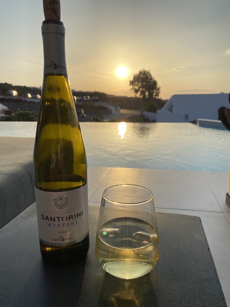 drinking wine in santorini greece