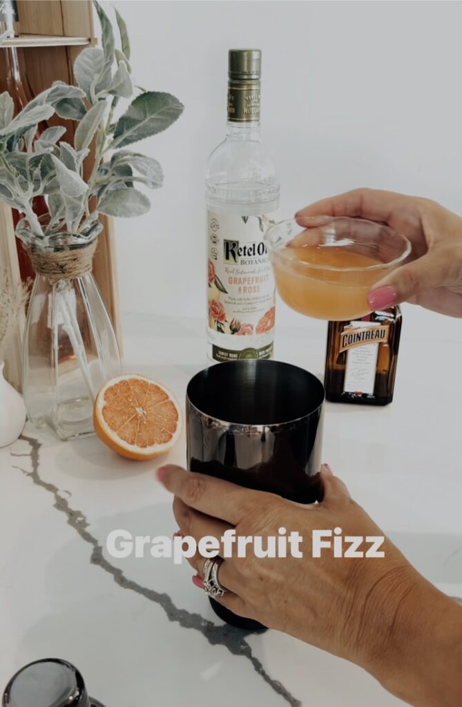 person holding grapefruit frizz