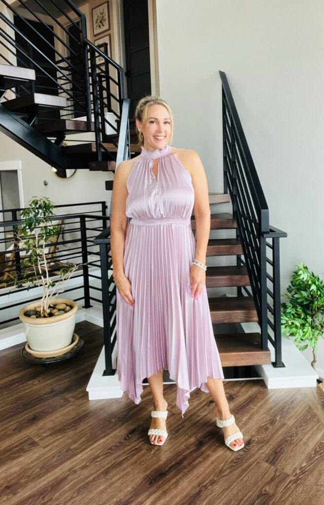 Stephanie Tapert wearing a Sleeveless Halter Dress for one of the wedding guest dresses